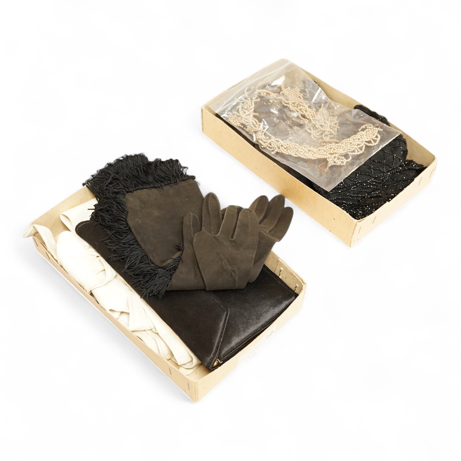 A cut steel fronter, a jet beaded panel, a pair of fringed black suede gauntlets, a seed pearl headdress, etc.